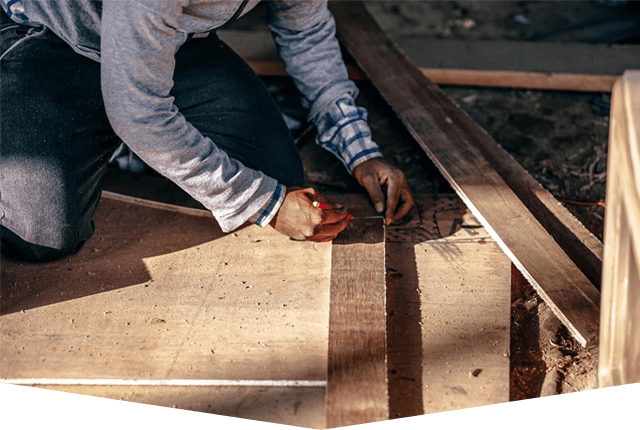 Carpenter Taking Measurement of a Wooden Plank. Profession, Carpentry, Woodwork. Carpenter Taking Measurement of a Wooden Plank. Profession, Carpentry, Woodwork.